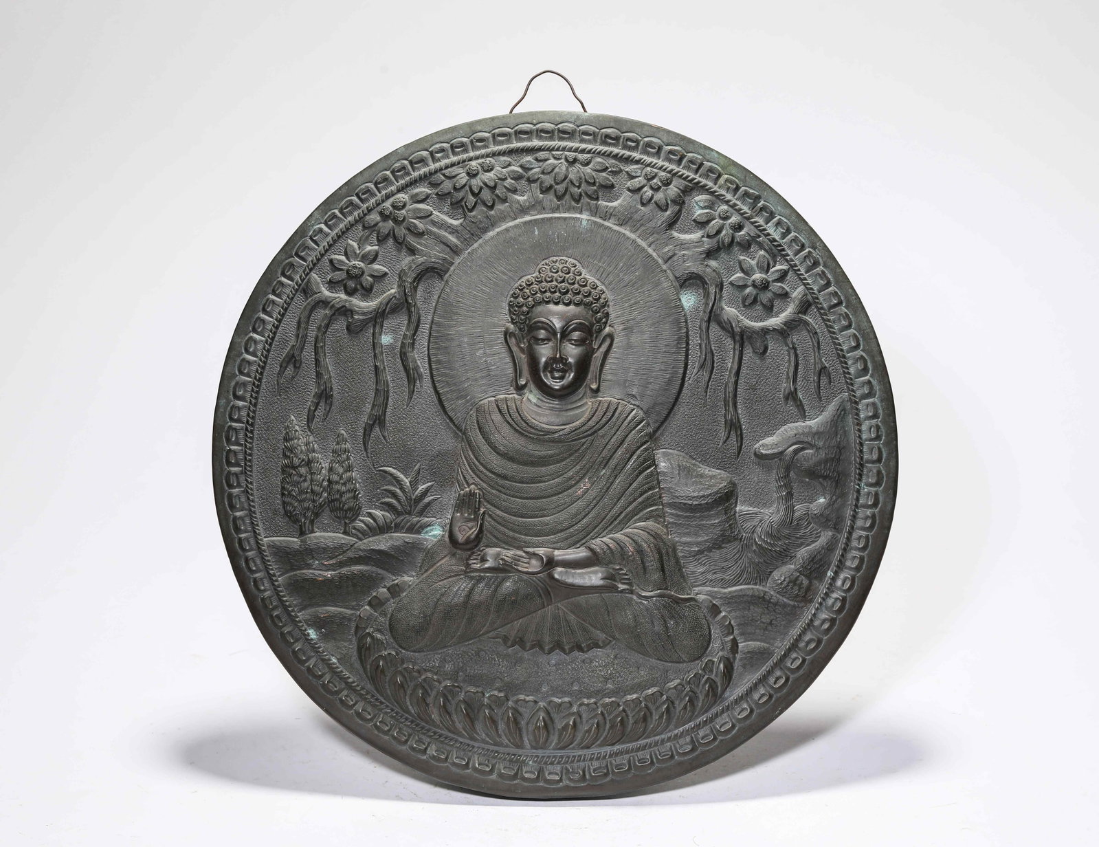 A Bronze 'Buddha' Pendant: A Bronze 'Buddha' Pendant Dimensions: Weight: 462g. Width: 29.5 cm (11.61 in). All measurements are approximate.