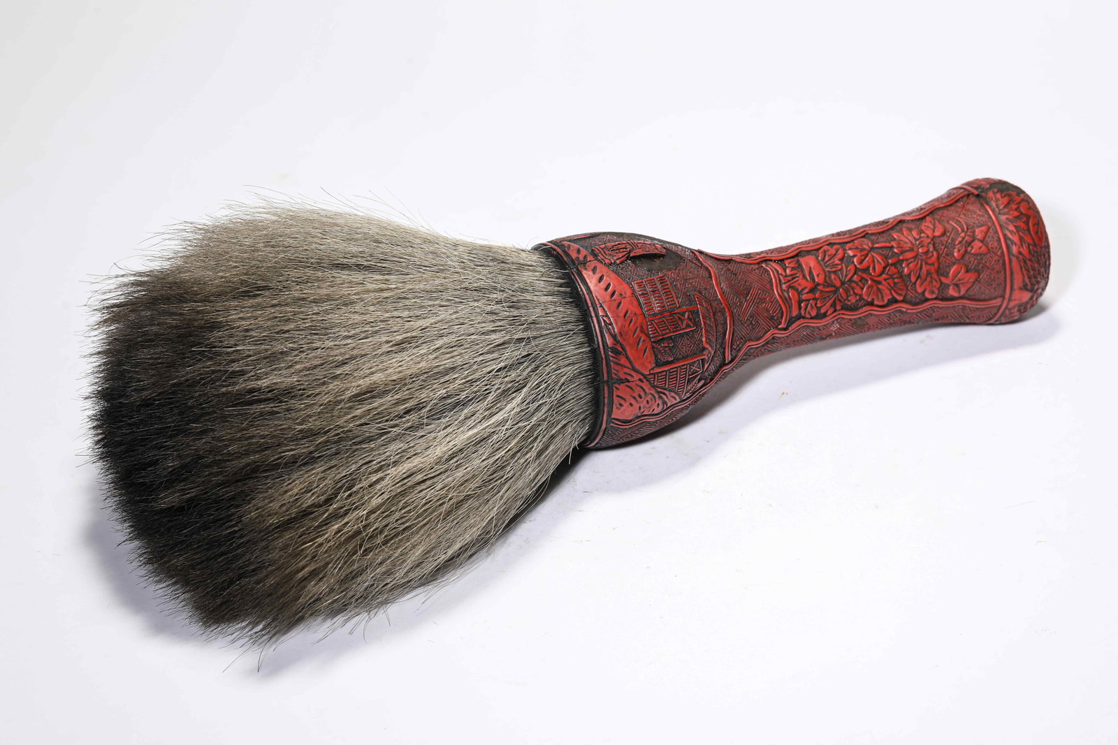 A Carved Cinnabar Lacquer 'Floral' Writing Brush: A Carved Cinnabar Lacquer 'Floral' Writing Brush Dimensions: Width: 8.0 cm (3.15 in) x Height: 36.5 cm (14.37 in). All measurements are approximate.