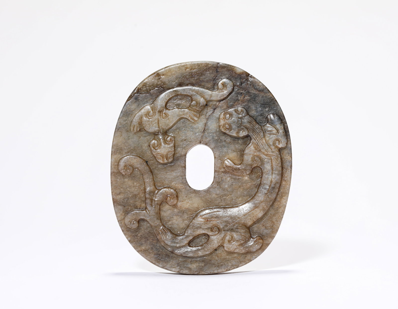 A Jade 'Dragon Instructing its Young' Plaque: A Jade 'Dragon Instructing its Young' Plaque Dimensions: Width: 7.0 cm (2.76 in) x Height: 6.0 cm (2.36 in). All measurements are approximate.