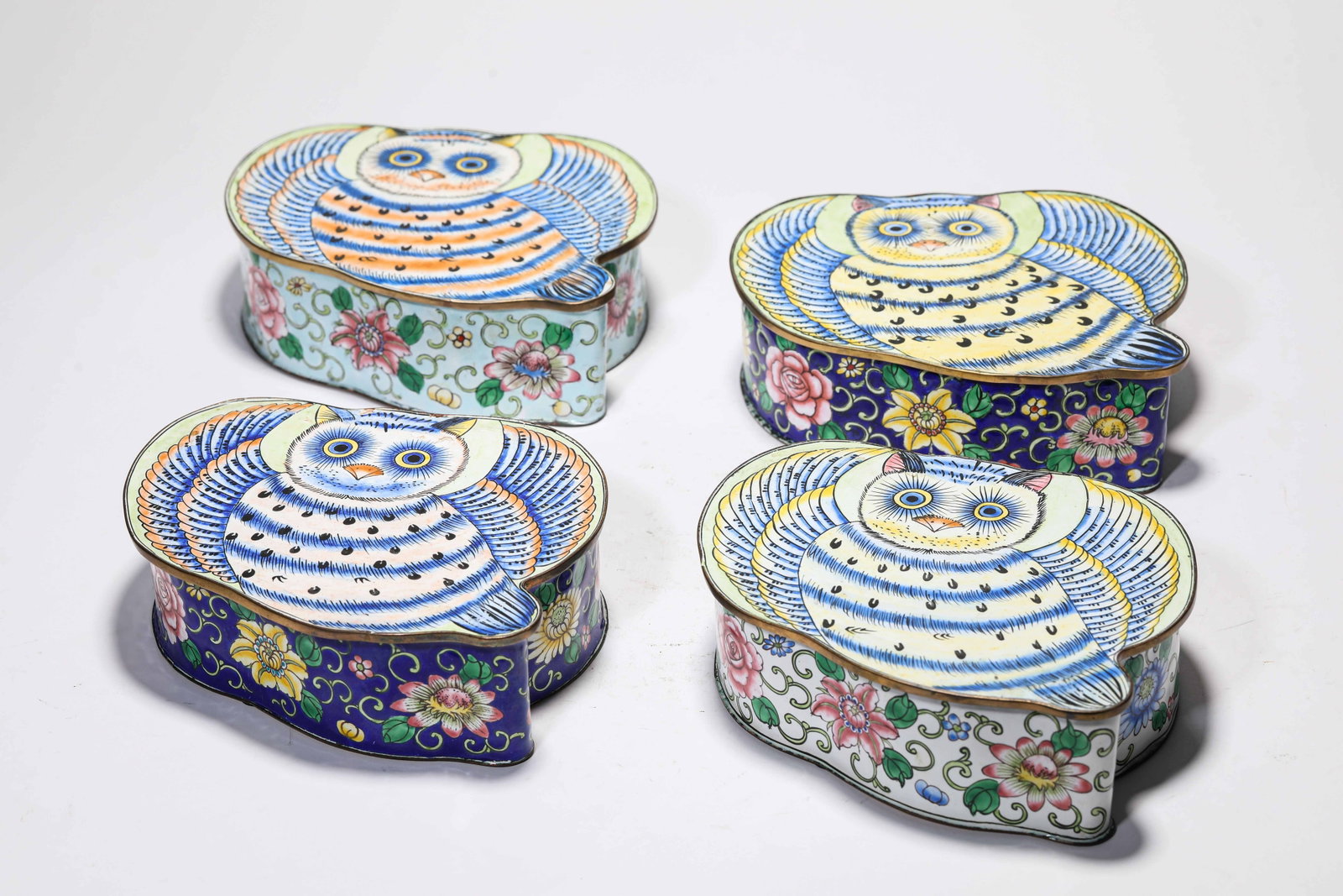 A Group of Copper Painted Enamel 'Flowers and Birds' Boxes: A Group of Copper Painted Enamel 'Flowers and Birds' Boxes Dimensions: Weight: 1834g. Length: 17.9 cm (7.05 in) x Width: 13.4 cm (5.28 in) x Height: 5.1 cm (2.01 in). All measurements are approximate.
