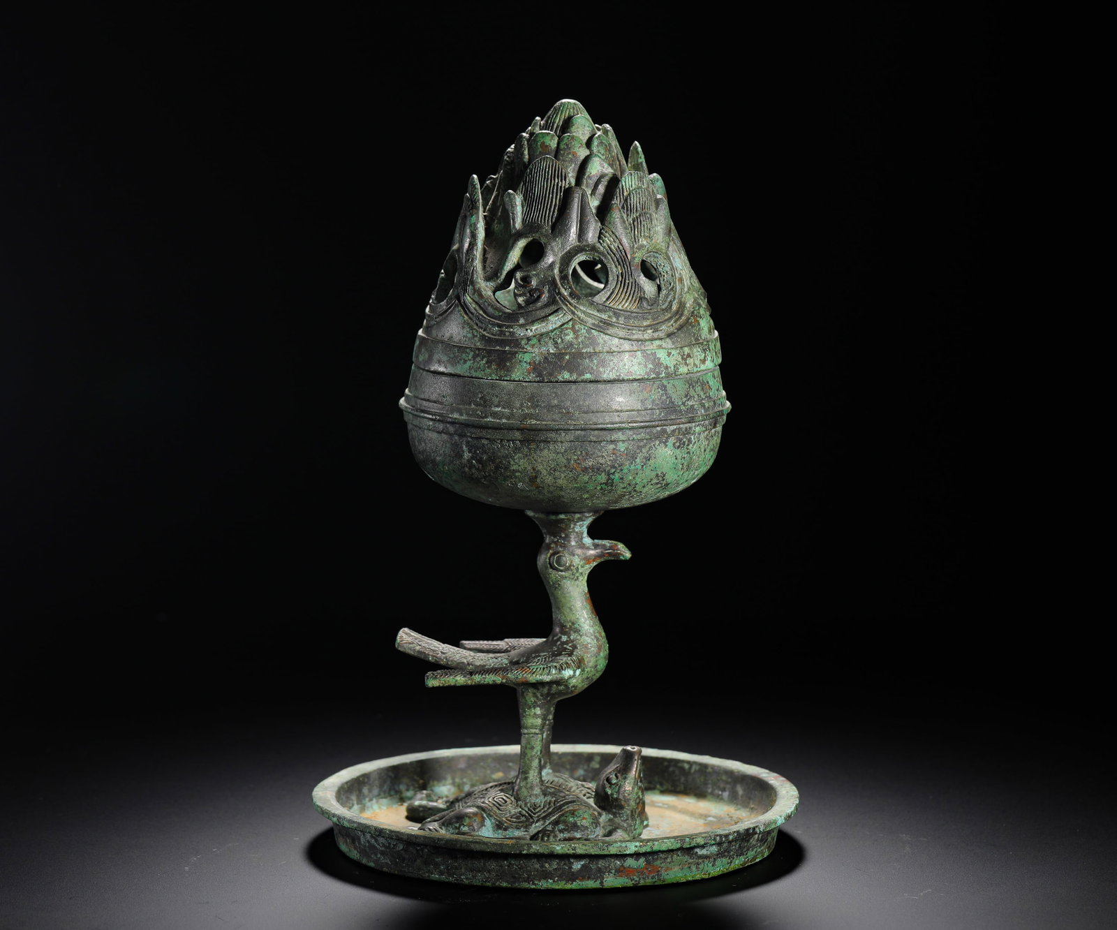 A Western Han Dynasty Bronze 'Boshan' Censer with 'Divine Bird and Tortoise' Base: A Western Han Dynasty Bronze 'Boshan' Censer with 'Divine Bird and Tortoise' Base H:26cm (10.24in) W:16cm (6.30in) Weight:1960g (4.32lb)This is a Western Han Dynasty incense burner. The lid is shaped 