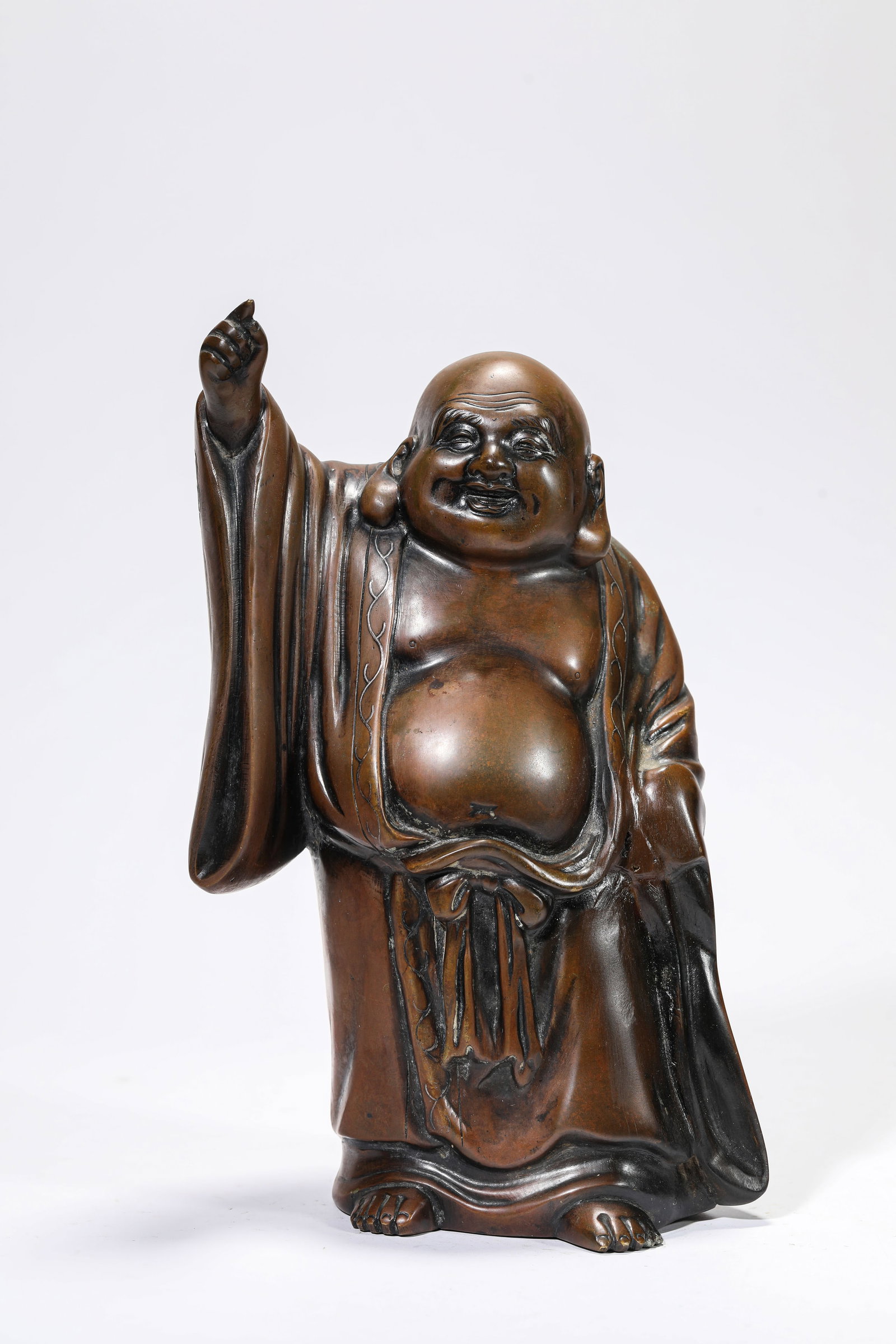 A Silver Wire-Inlaid Bronze Figure of Buddha: A Silver Wire-Inlaid Bronze Figure of Buddha Dimensions: Weight: 3326g. Length: 16.5 cm (6.50 in) x Width: 11.5 cm (4.53 in) x Height: 27.0 cm (10.63 in). All measurements are approximate.