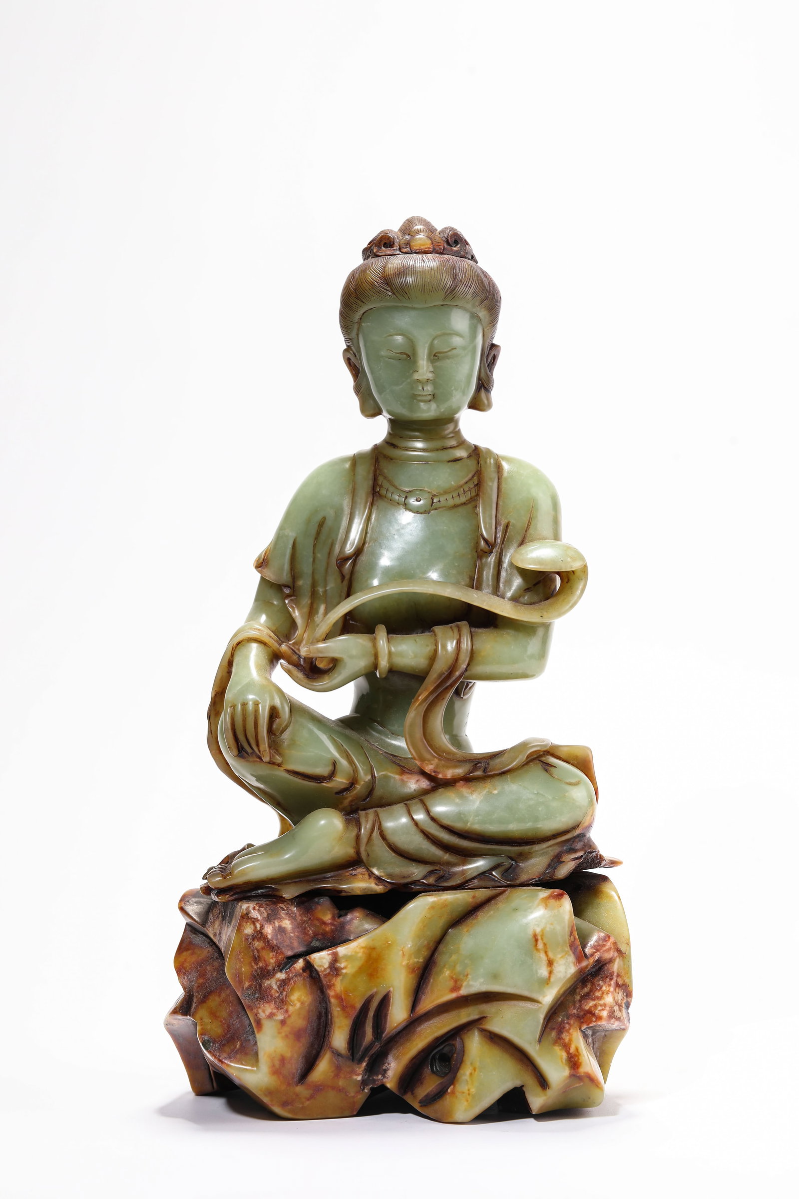 A Jade 'Ruyi-Holding' Figure of Avalokiteshvara: A Jade 'Ruyi-Holding' Figure of Avalokiteshvara Dimensions: Length: 17.0 cm (6.69 in) x Width: 12.3 cm (4.84 in) x Height: 33.5 cm (13.19 in). All measurements are approximate.