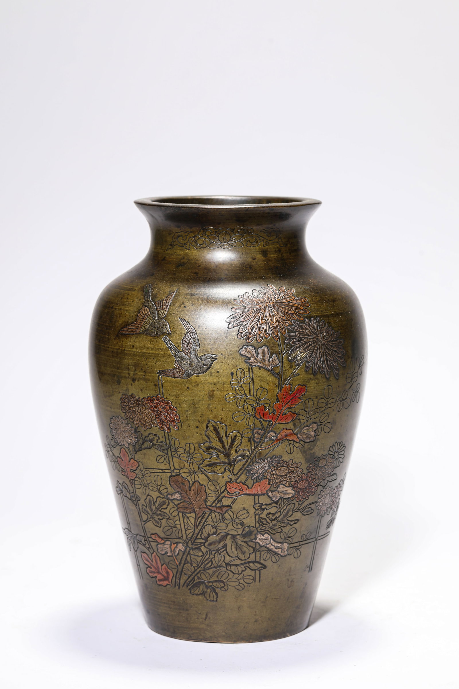 A Silver-Inlaid Bronze 'Flowers and Birds' Vase: A Silver-Inlaid Bronze 'Flowers and Birds' Vase Dimensions: Weight: 1.95kg. Width: 15.2 cm (5.98 in) x Height: 23.7 cm (9.33 in). All measurements are approximate.
