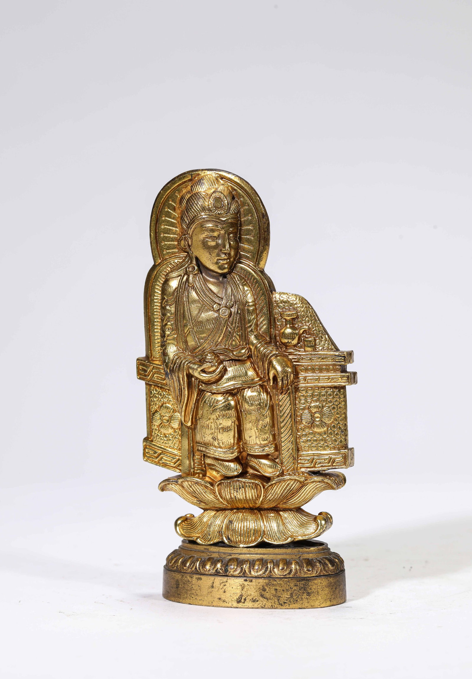 A Gilt-Bronze Figure of Buddha: A Gilt-Bronze Figure of Buddha Dimensions: Weight: 288g. Length: 7.2 cm (2.83 in) x Width: 4.3 cm (1.69 in) x Height: 13.3 cm (5.24 in). All measurements are approximate.