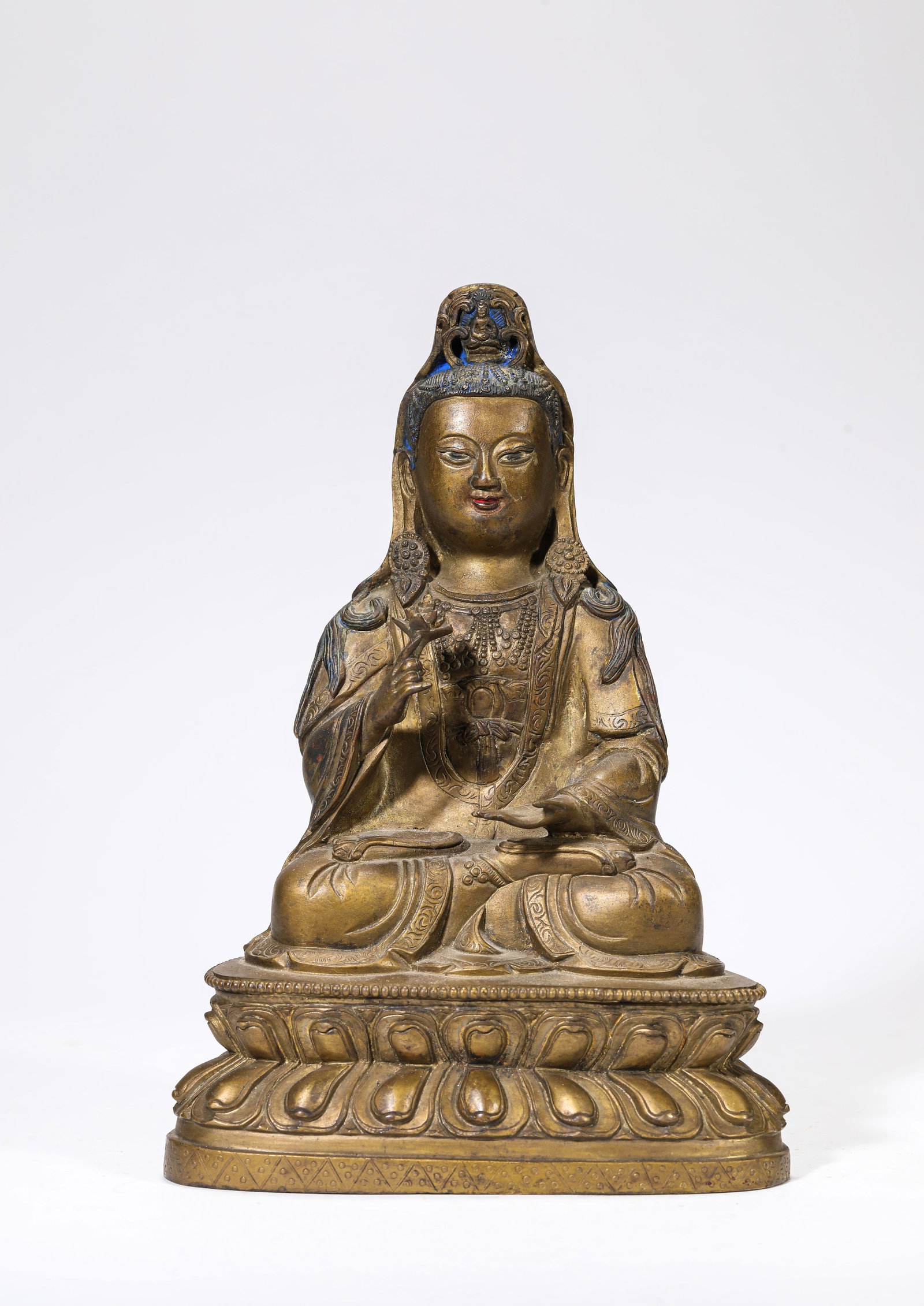 A Gilt-Bronze Figure of Avalokiteshvara: A Gilt-Bronze Figure of Avalokiteshvara Dimensions: Weight: 2936g. Length: 16.3 cm (6.42 in) x Width: 10.9 cm (4.29 in) x Height: 23.3 cm (9.17 in). All measurements are approximate.
