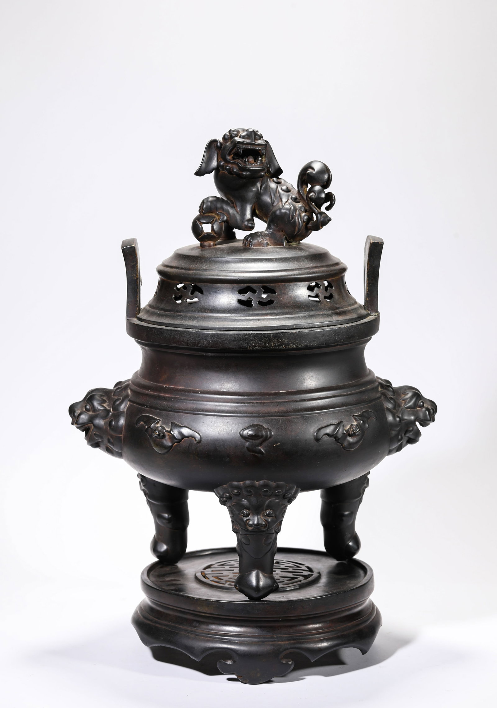 A Bronze 'Lion-Form Finial' Censer: A Bronze 'Lion-Form Finial' Censer Dimensions: Weight: 11.6kg. Length: 34.0 cm (13.39 in) x Width: 27.5 cm (10.83 in) x Height: 50.5 cm (19.88 in). All measurements are approximate.