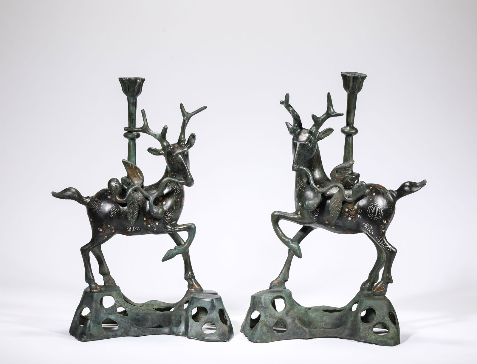 A Silver Wire-Inlaid Bronze Candleholder: A Silver Wire-Inlaid Bronze Candleholder Dimensions: Weight: 6.95kg. Length: 21.5 cm (8.46 in) x Width: 11.0 cm (4.33 in) x Height: 34.0 cm (13.39 in). All measurements are approximate.