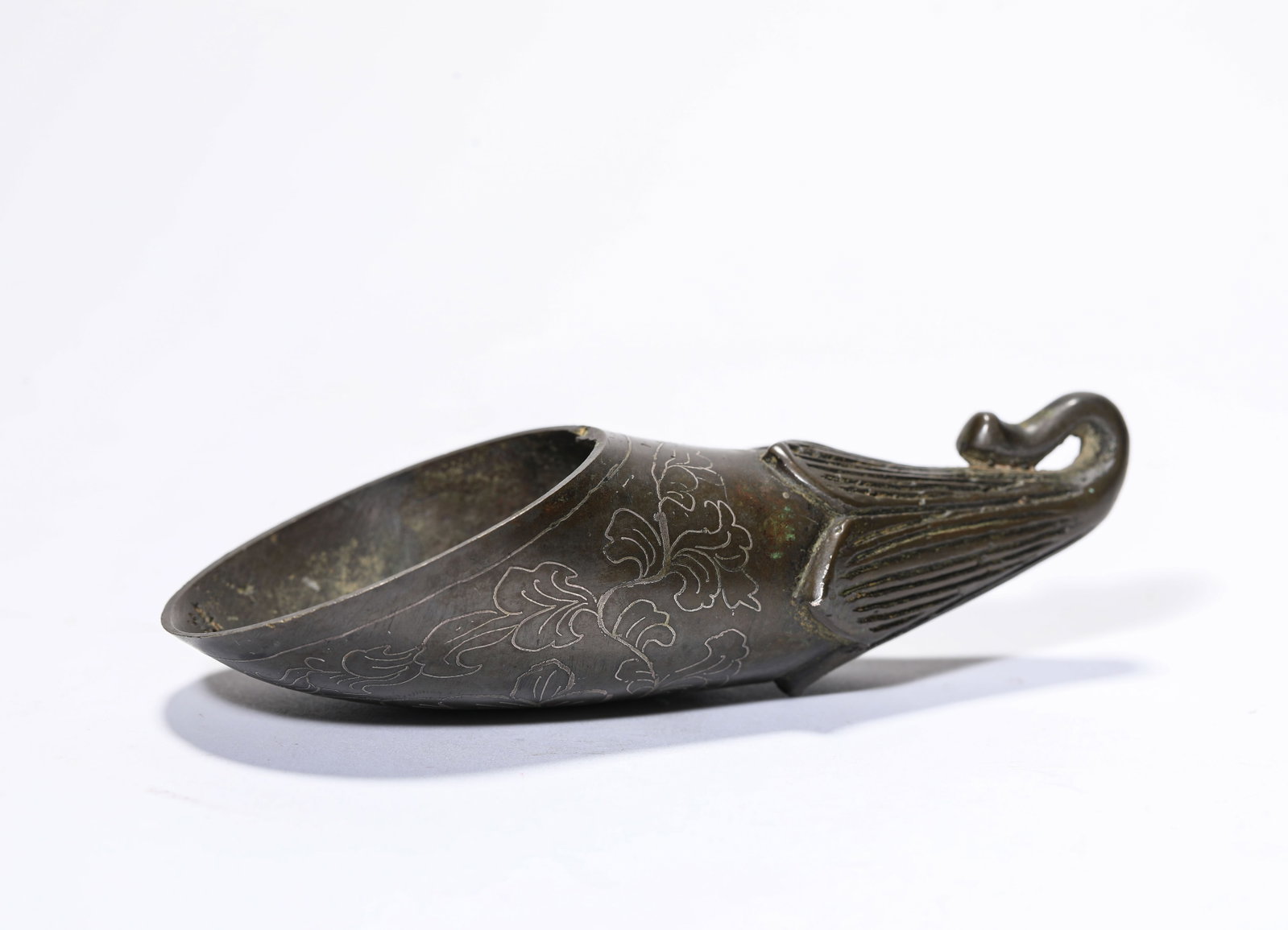 A Silver Wire-Inlaid Bronze 'Floral' Tea Scoop: A Silver Wire-Inlaid Bronze 'Floral' Tea Scoop Dimensions: Weight: 123g. Length: 11.4 cm (4.49 in) x Width: 4.6 cm (1.81 in) x Height: 3.1 cm (1.22 in). All measurements are approximate.