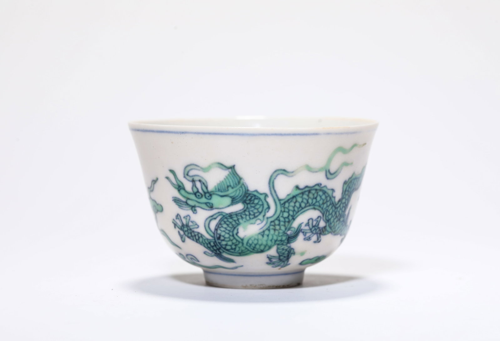A Green-Glazed 'Dragon and Clouds' Cup: A Green-Glazed 'Dragon and Clouds' Cup Dimensions: Width: 8.0 cm (3.15 in) x Height: 5.2 cm (2.05 in). All measurements are approximate.