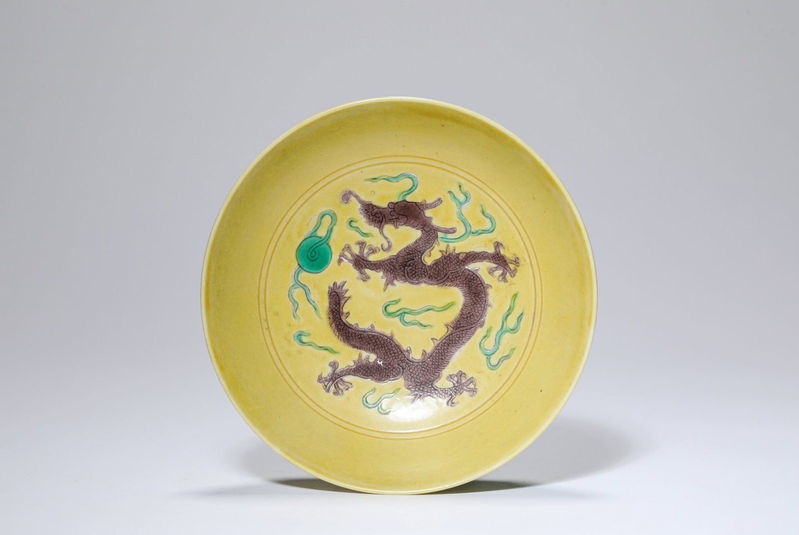 A Yellow-Ground Purple and Green-Glazed 'Dragon' Small Dish: A Yellow-Ground Purple and Green-Glazed 'Dragon' Small Dish Dimensions: Width: 11.0 cm (4.33 in). All measurements are approximate.