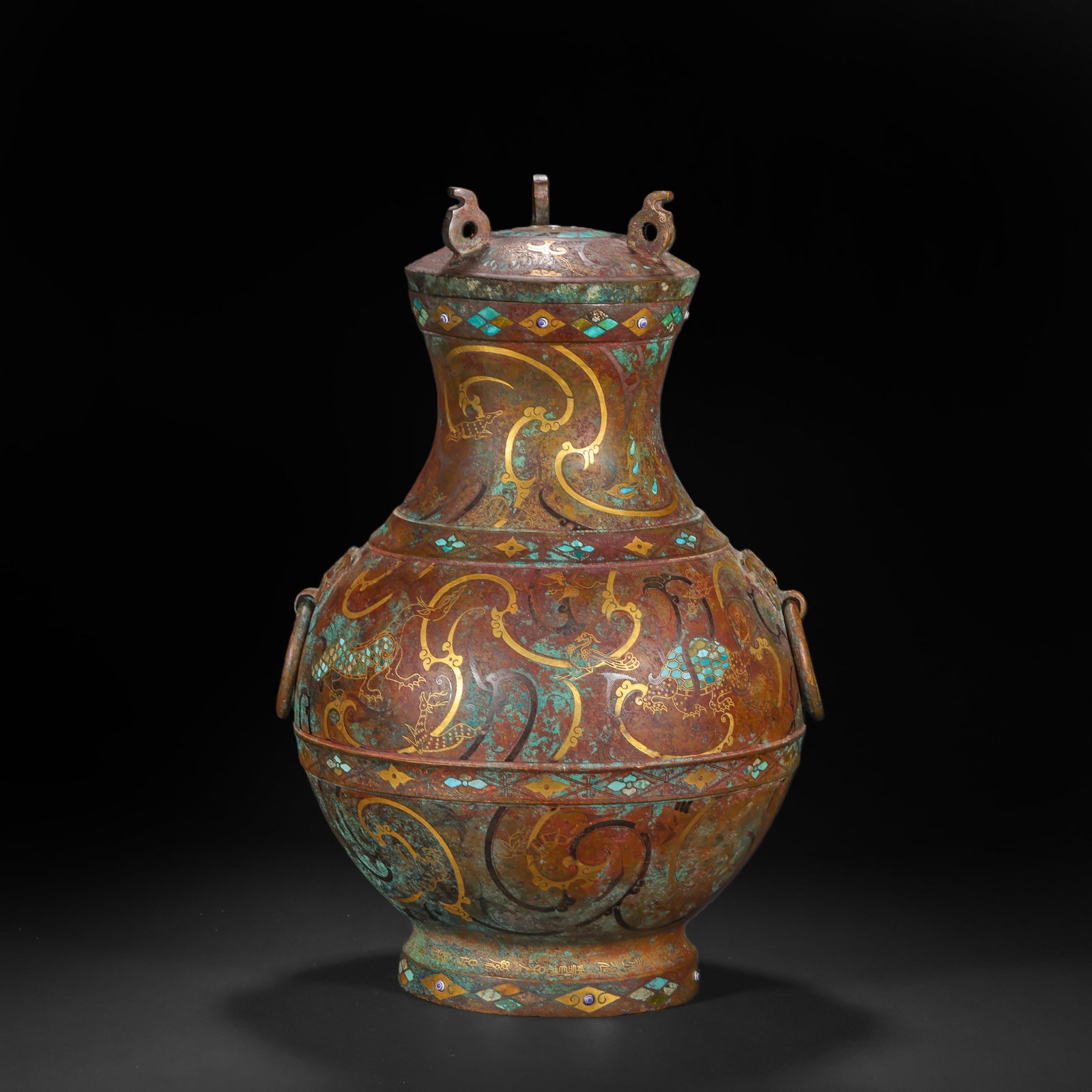 A Warring States Period Gold, Silver and Gem-Inlaid Bronze 'Dragon' Hu: A Warring States Period Gold, Silver and Gem-Inlaid Bronze 'Dragon' Hu H:37.0cm(14.57in) D:23.0cm(9.06in) Weight:4240g(9.35lb)This vessel is cast in bronze, fully decorated with dragon and cloud patte