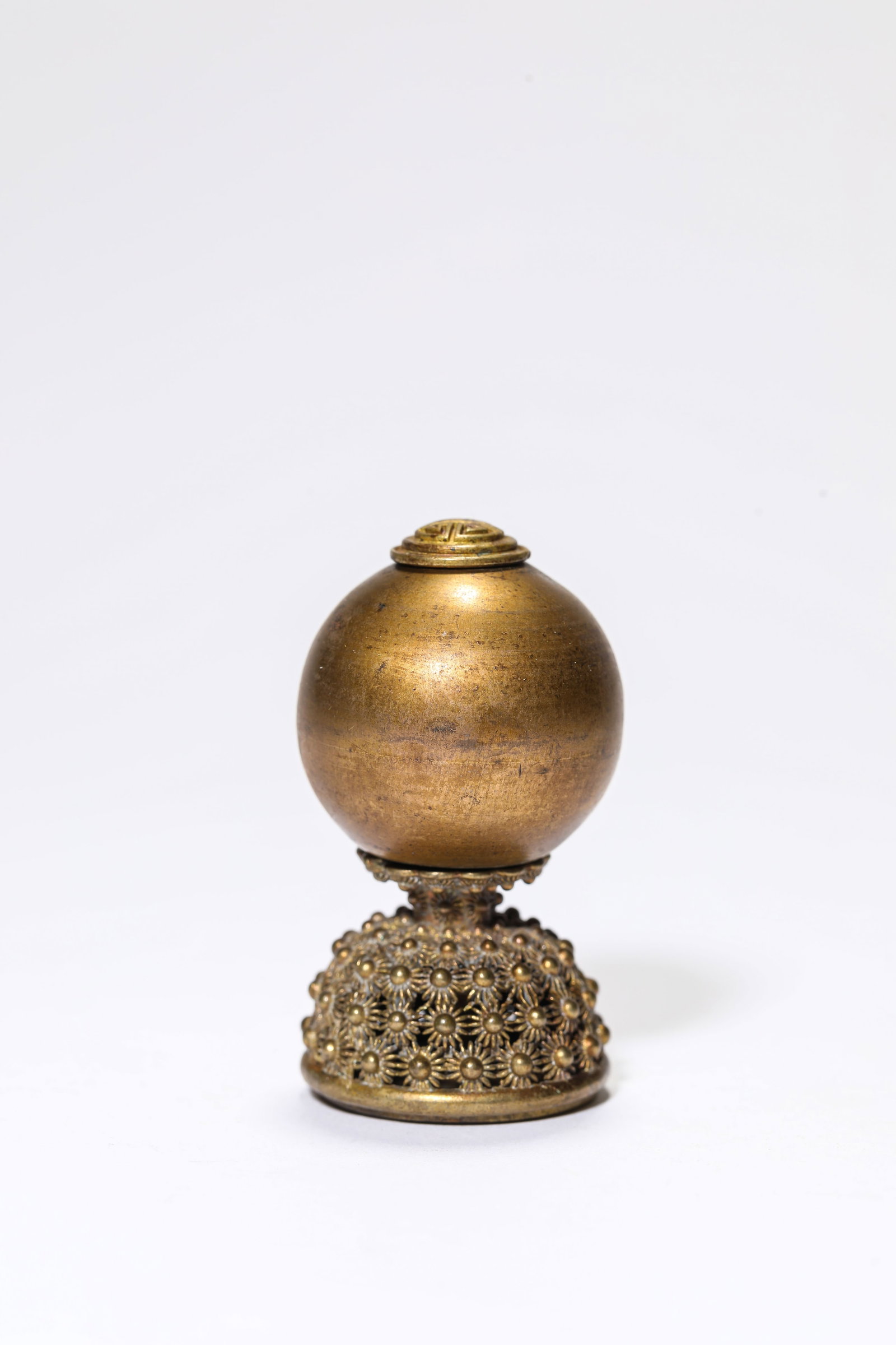 A Gilt-Bronze Censer Finial: A Gilt-Bronze Censer Finial Dimensions: Weight: 38g. Width: 3.0 cm (1.18 in) x Height: 5.4 cm (2.13 in). All measurements are approximate.