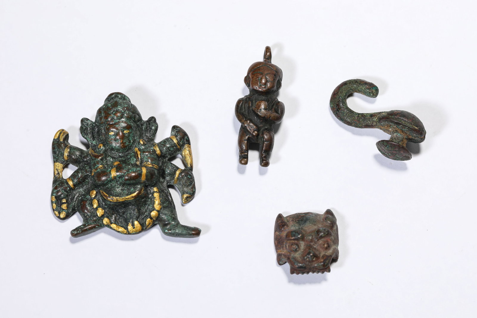 A Group of Bronze Objects: A Group of Bronze Objects Dimensions: Weight: 94g. Width: 4.5 cm (1.77 in) x Height: 4.7 cm (1.85 in). Width: 2.0 cm (0.79 in) x Height: 2.2 cm (0.87 in). Weight: 219g. Width: 2.6 cm (1.02 in) x Heigh