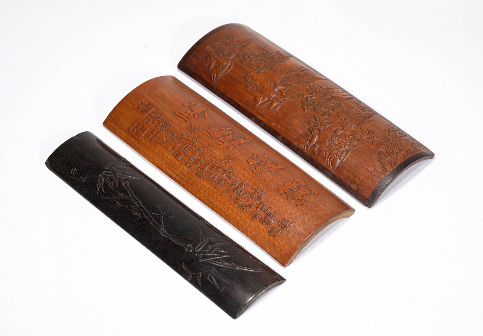 A Group of Bamboo and Wood Armrests: A Group of Bamboo and Wood Armrests Dimensions: Width: 10.2 cm (4.02 in) x Height: 27.9 cm (10.98 in). Width: 10.2 cm (4.02 in) x Height: 26.3 cm (10.35 in). Width: 6.5 cm (2.56 in) x Height: 27.4 cm 