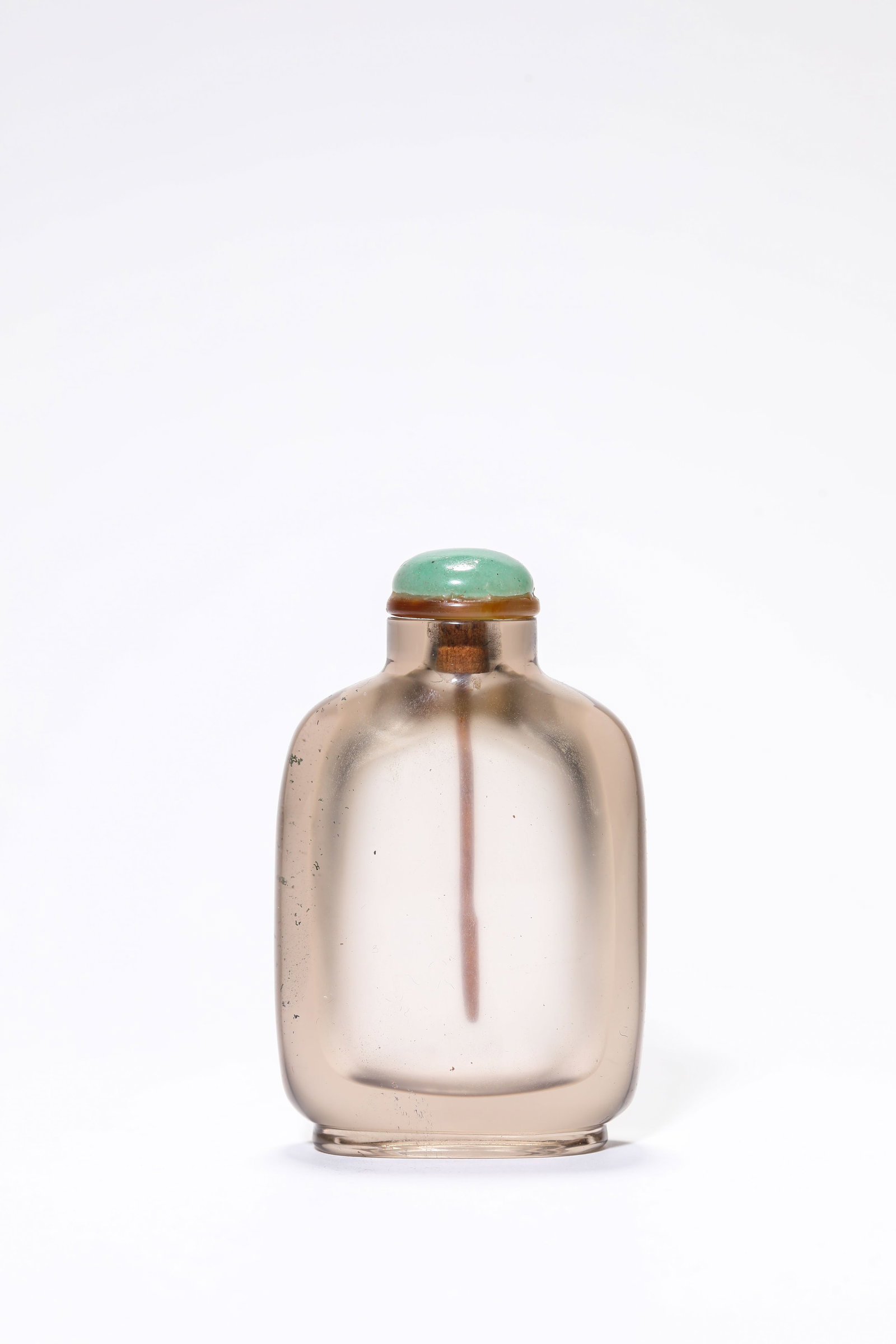 A Rock Crystal Snuff Bottle: A Rock Crystal Snuff Bottle Dimensions: Length: 4.8 cm (1.89 in) x Width: 2.2 cm (0.87 in) x Height: 7.7 cm (3.03 in). All measurements are approximate.