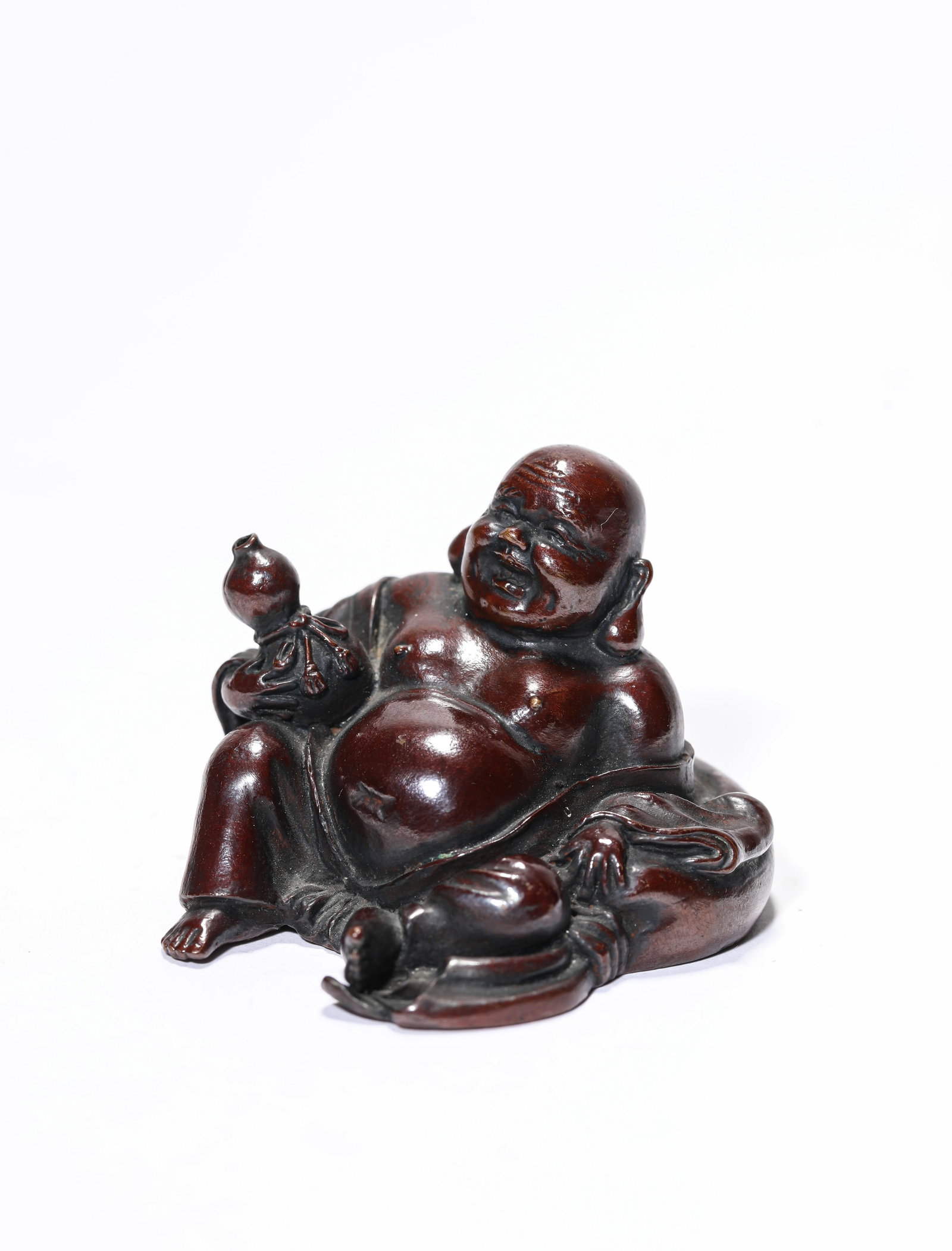 A Bronze Figure of Maitreya: A Bronze Figure of Maitreya Dimensions: Weight: 230g. Length: 6.1 cm (2.40 in) x Width: 6.6 cm (2.60 in) x Height: 4.7 cm (1.85 in). All measurements are approximate.