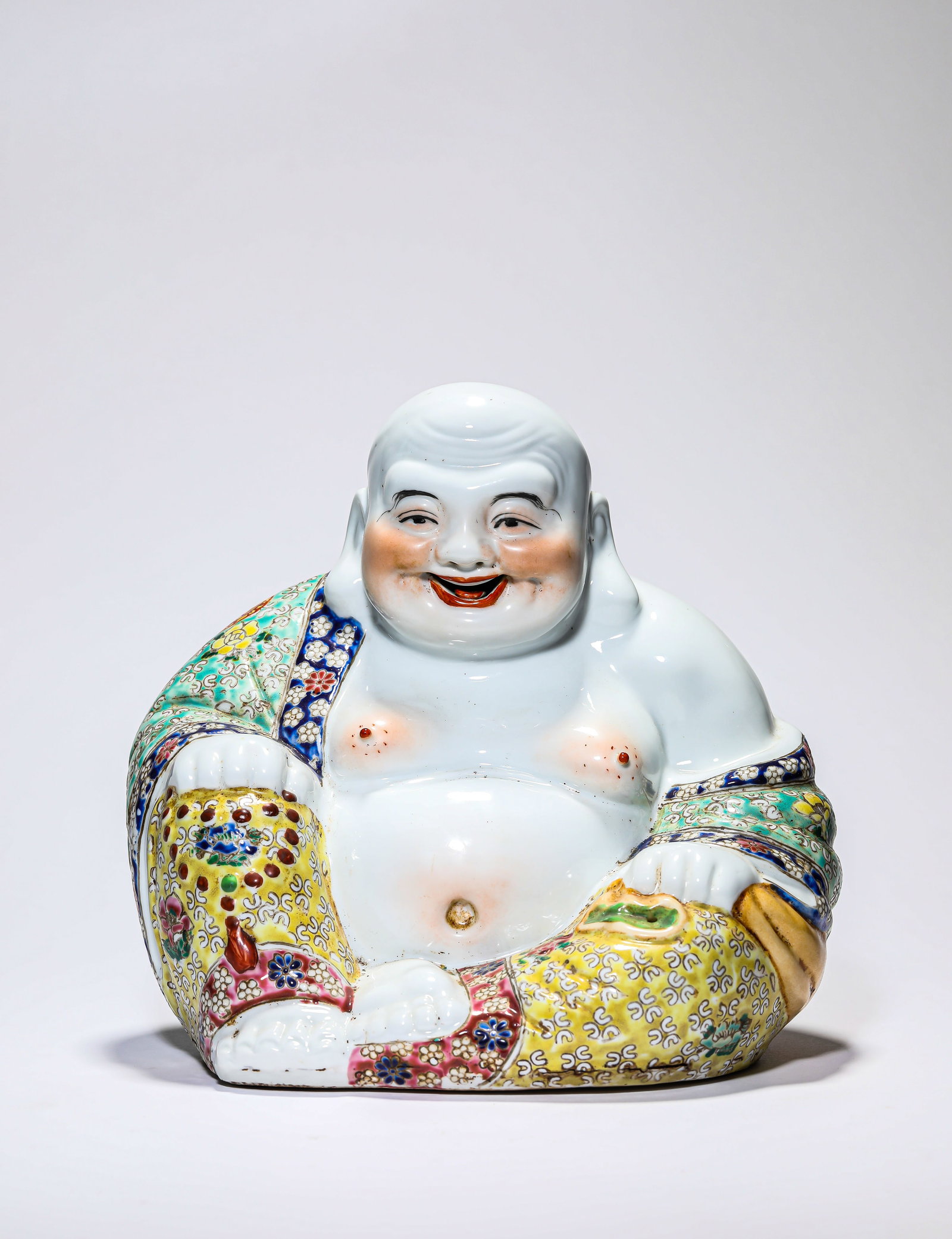 A Famille-Rose Figure of Maitreya: A Famille-Rose Figure of Maitreya Dimensions: Width: 23.0 cm (9.06 in) x Height: 23.0 cm (9.06 in). All measurements are approximate.