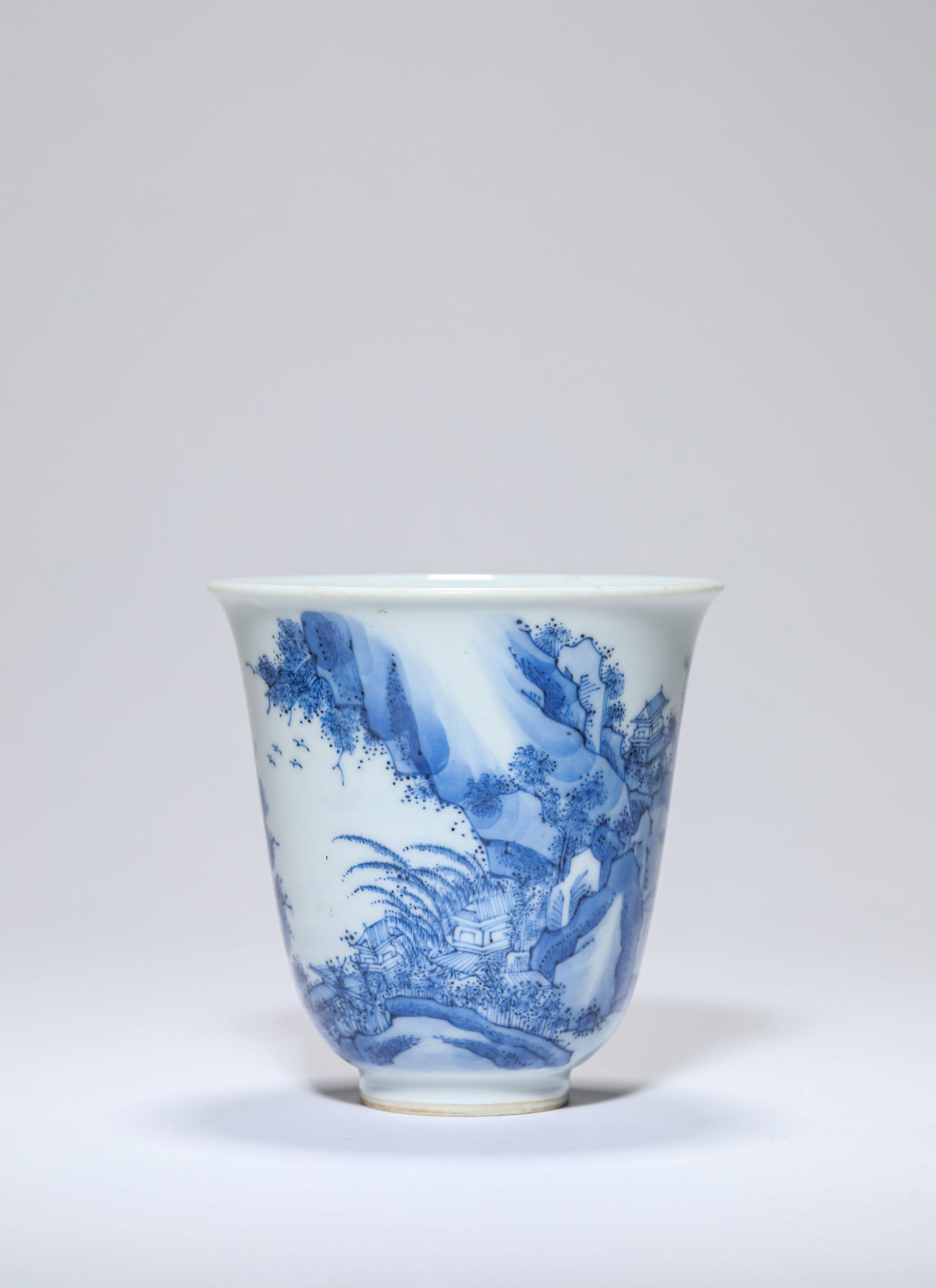 A Blue and White 'Landscape' 'Bell-Form' Cup: A Blue and White 'Landscape' 'Bell-Form' Cup Dimensions: Height: 10.0 cm (3.94 in) x Width: 9.5 cm (3.74 in). All measurements are approximate.