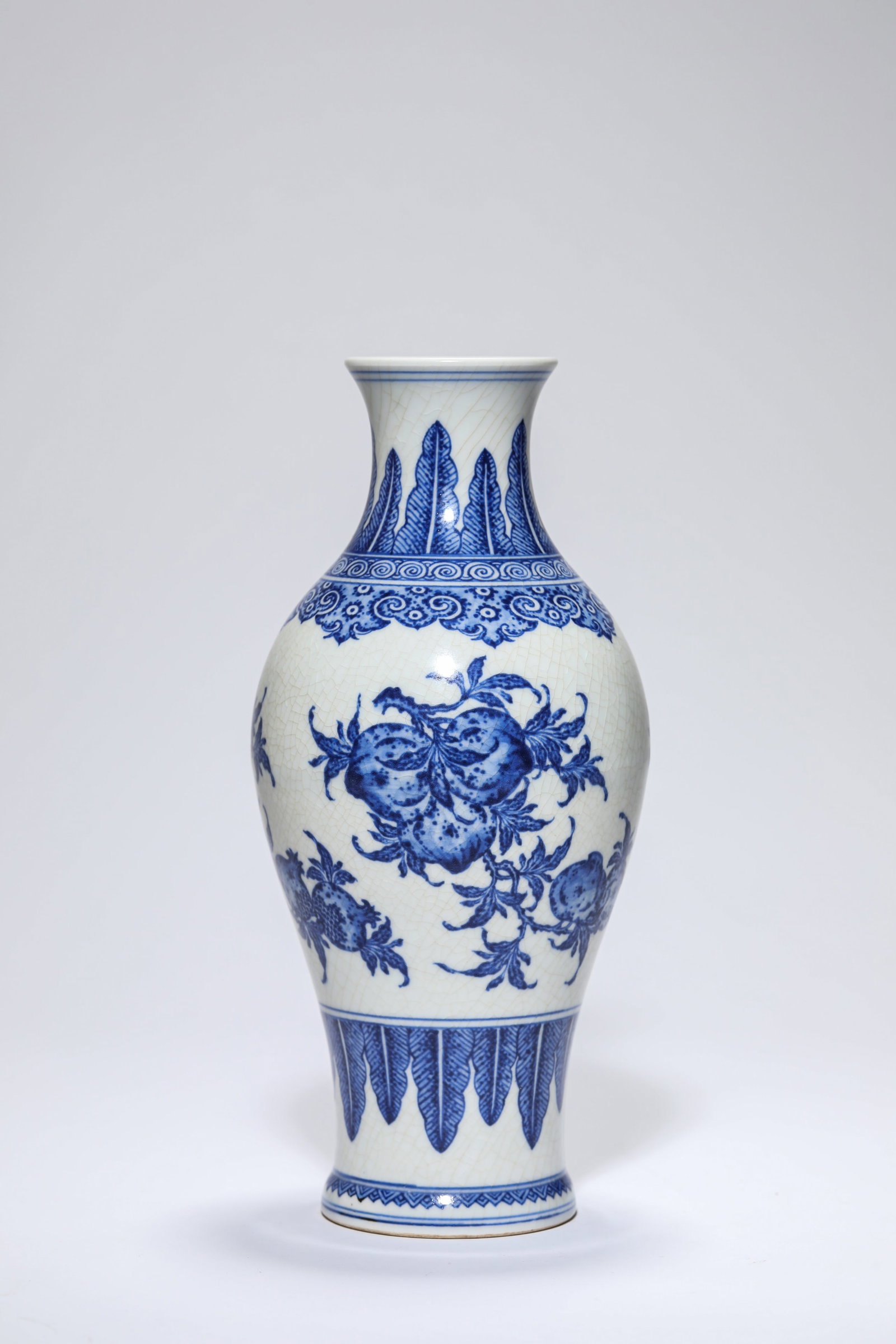 A Blue and White 'Branched Florals' 'Guanyin' Vase: A Blue and White 'Branched Florals' 'Guanyin' Vase Dimensions: Height: 22.0 cm (8.66 in). All measurements are approximate.