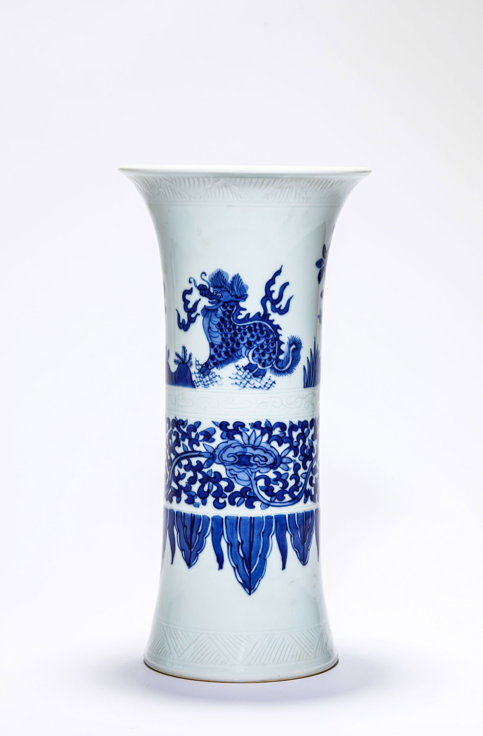A Blue and White 'Kylin Paying Homage to Phoenix' 'Gu' Beaker: A Blue and White 'Kylin Paying Homage to Phoenix' 'Gu' Beaker Dimensions: Height: 28.0 cm (11.02 in). All measurements are approximate.