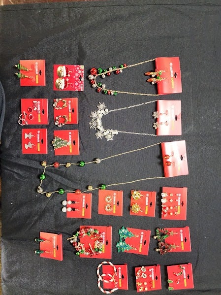 CHRISTMAS EARRINGS, NECKLACES & BRACELETS LOT: A festive assortment of Christmas-themed jewelry perfect for holiday gifting or resale! This collection includes colorful necklaces, earrings, and bracelets featuring designs such as snowflakes, Chris