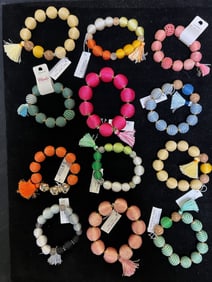 VIBRANT THREAD - WRAPPED BEAD BRACELET WITH TASSELS