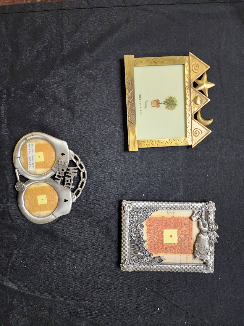 LOT OF 3 DECORATIVE PICTURE FRAMES - DIFFERENT DESIGNS: Charming set of 3 decorative picture frames featuring unique and whimsical designs. Includes a gold “Family” frame with celestial accents, a silver angel-themed frame with floral detailing, an