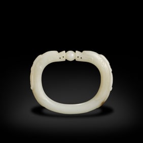 Qing Dynasty Hetian white jade horse-hoof-shaped bracelet with double dragon patterns