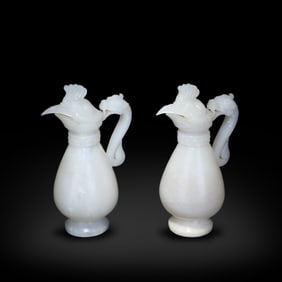 Ming Dynasty or earlier A pair of phoenix-head jade ewers