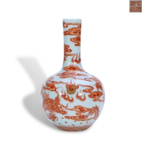 Qianlong period Qing Dynasty Small iron-red sky-ball vase with dragon-cloud motifs