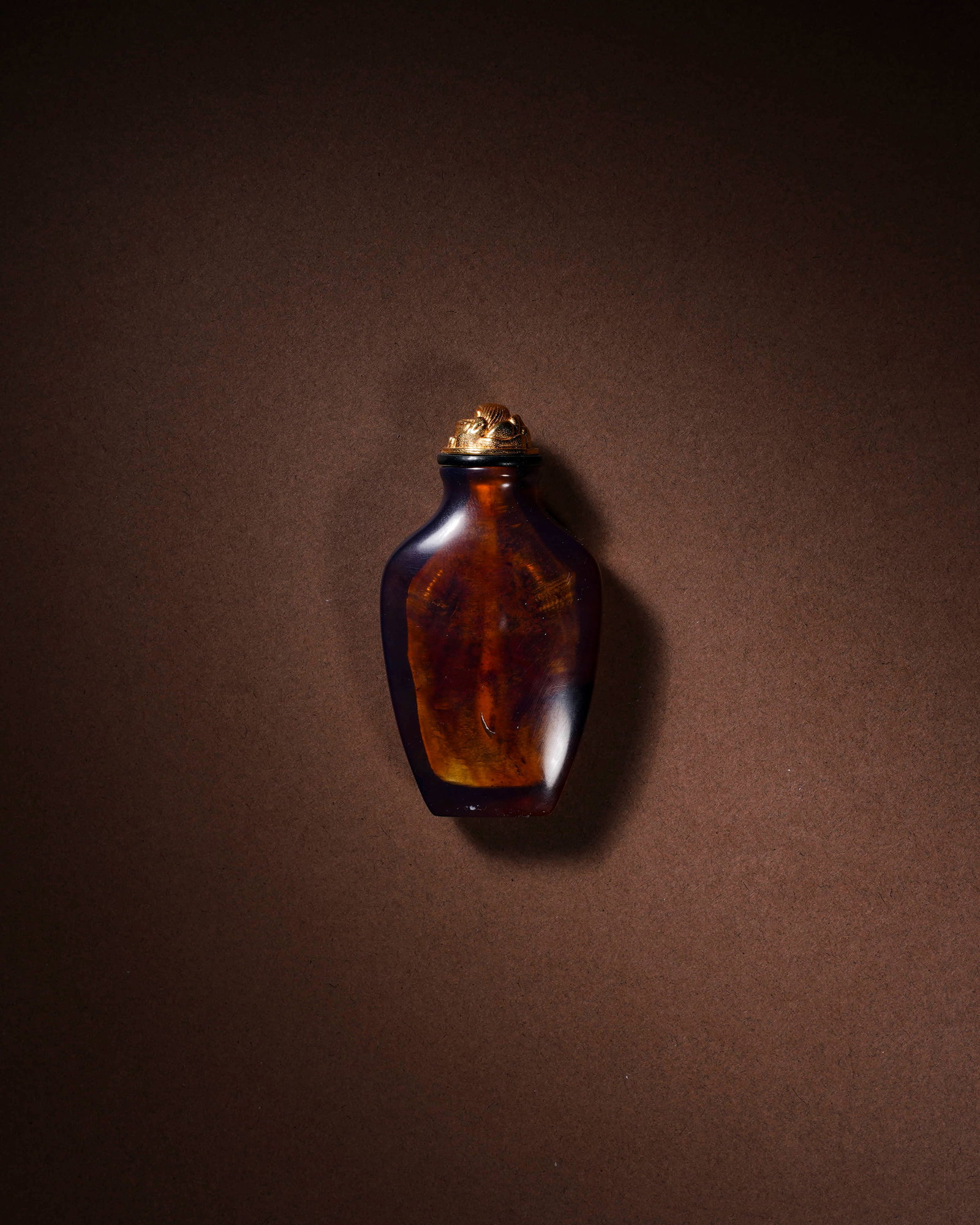 Clear amber snuff bottle: L:3.6cm H:6.8cm