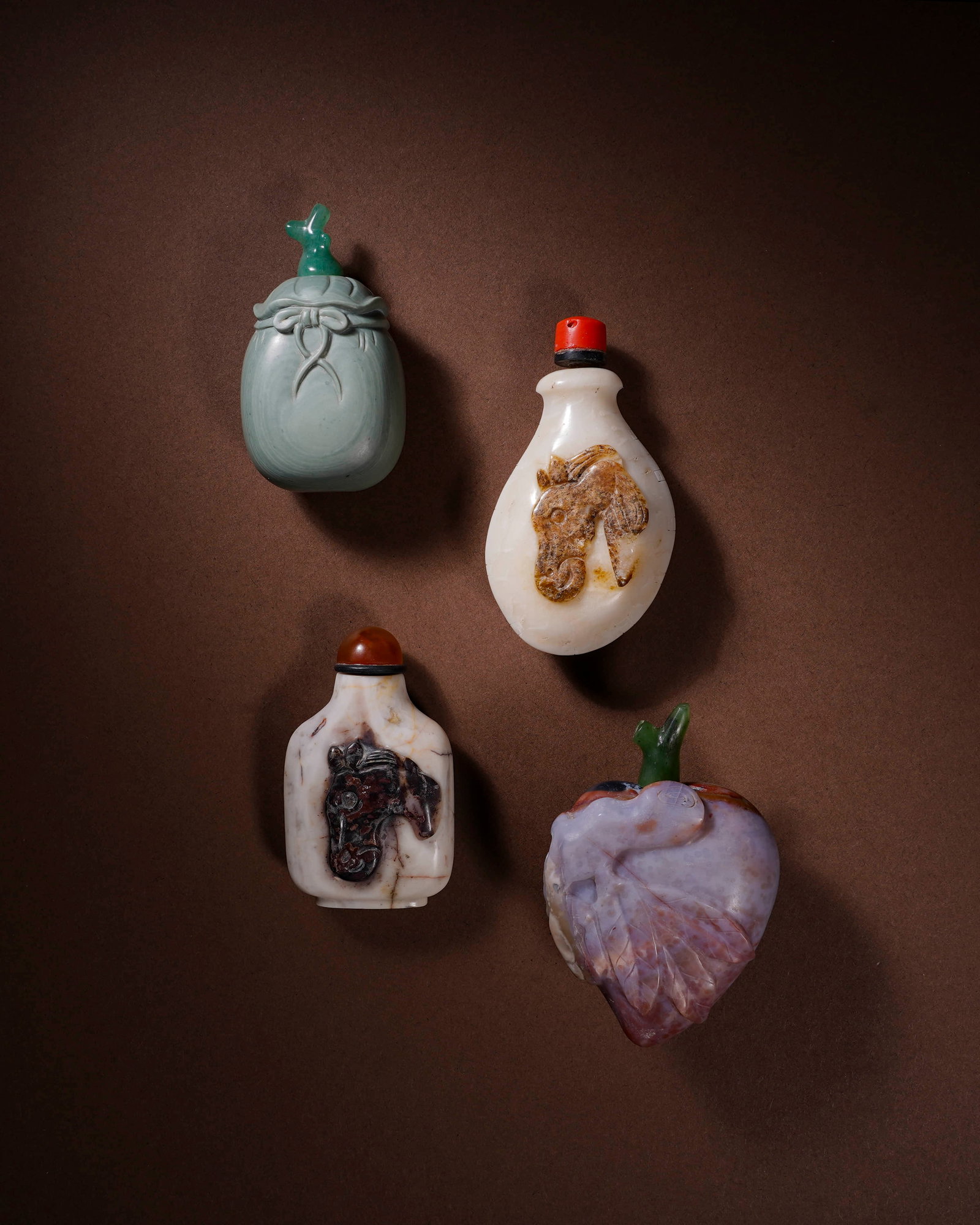 Snuff bottles a group of four.: L:4cm H:7cm /L:4.6cm H:7cm /L:3.8cm H:6.2cm /L:3.5cm H:6cm