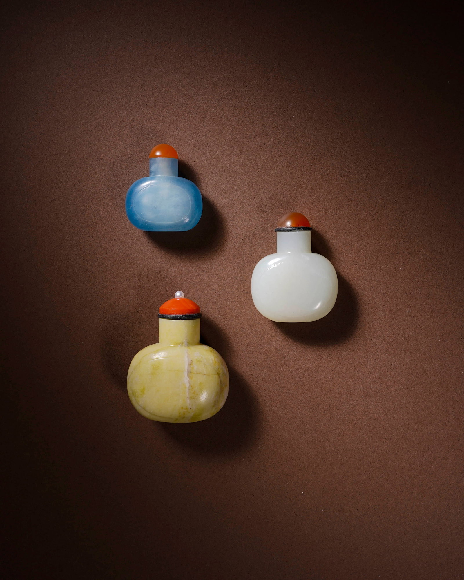 Qing Hetian jade Hailanbao snuff bottle group of three. (1 of 2)