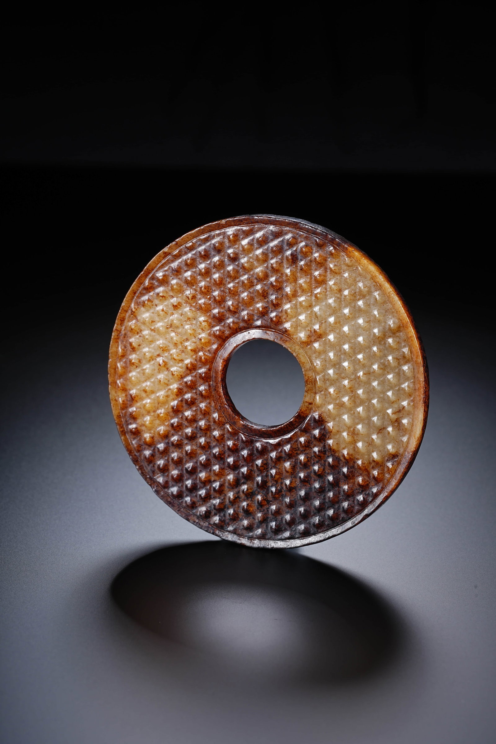 A CHINESE JADE BI DISC WITH 'DRUM' MOTIF (1 of 8)