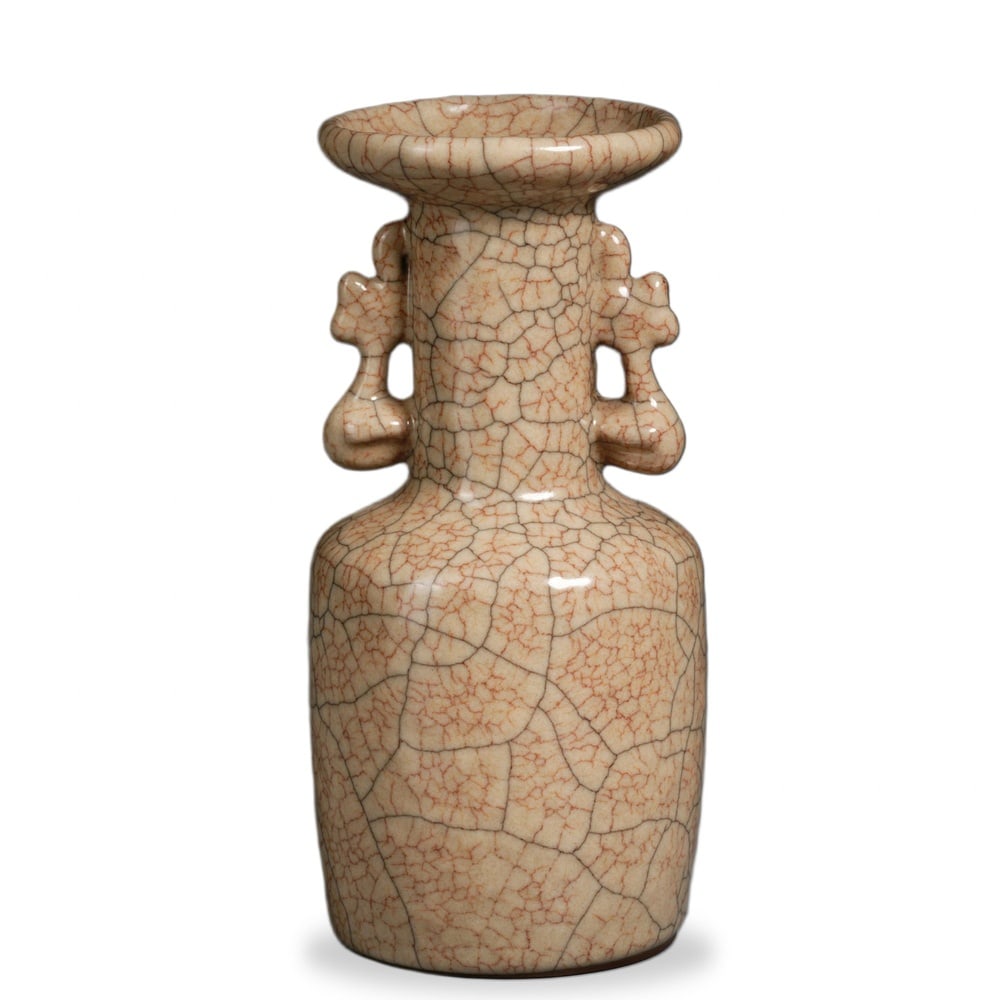 GE WARE CREAM-YELLOW GLAZED 'ICE-CRACKLE' MALLET VASE WITH TUBULAR HANDLES: Ge Ware Cream-Yellow Glazed 'Ice-Crackle' Mallet Vase with Tubular Handles Dimensions: H: 6 3/4 in (17 cm); W: 3 1/4 in (8 cm) This refined mallet vase exemplifies one of the most enduring small forms