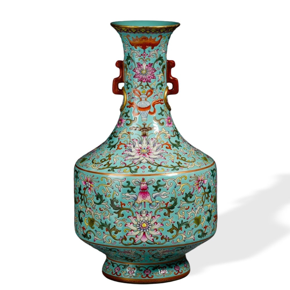 QIANLONG FAMILLE ROSE 'LOTUS SCROLL AND BUDDHIST EMBLEMS' TWIN-HANDLED VASE ON TURQUOISE GROUND (1 of 3)