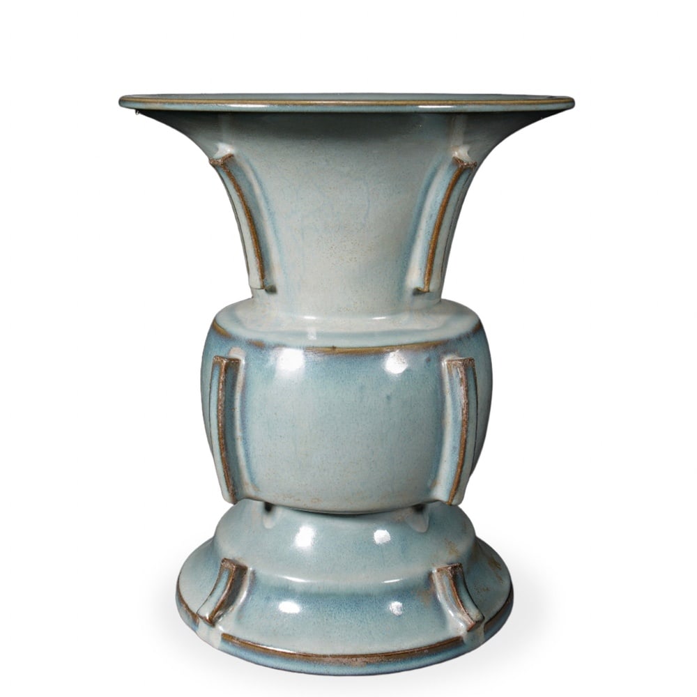 SONG DYNASTY JUN WARE MOON-WHITE GLAZED ARCHAISTIC ZUN WITH FLANGE RIDGES: Song Dynasty Jun Ware Moon-White Glazed Archaistic Zun with Flange Ridges Dimensions: H: 13 in (33 cm); W: 10 5/8 in (27 cm) This impressive archaistic zun is among the most celebrated Song-dynasty