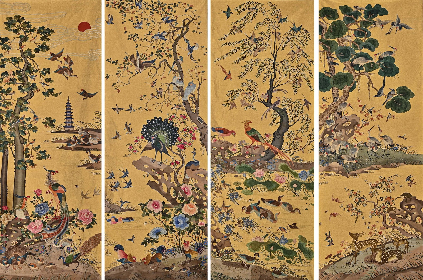 A SET OF CHINESE KESI 'ALL BIRDS PAYING HOMAGE TO THE PHOENIX' FABRIC: This set of four embroidered panels (possibly hanging scrolls or screen inserts) is crafted on a brilliant imperial yellow silk ground, together forming a grand and intricate panoramic narrative of "A