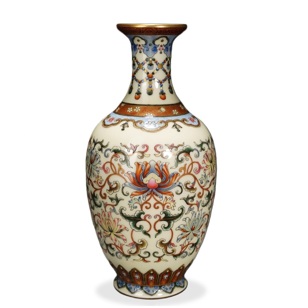 QIANLONG FAMILLE ROSE 'WESTERN LOTUS SCROLL' BOTTLE VASE ON CREAM-YELLOW GROUND: Qianlong Famille Rose 'Western Lotus Scroll' Bottle Vase on Cream-Yellow Ground Dimensions: H: 8 in (20.5 cm); W: 3 3/4 in (9.5 cm) This refined bottle vase exemplifies the precision of Qianlong-perio