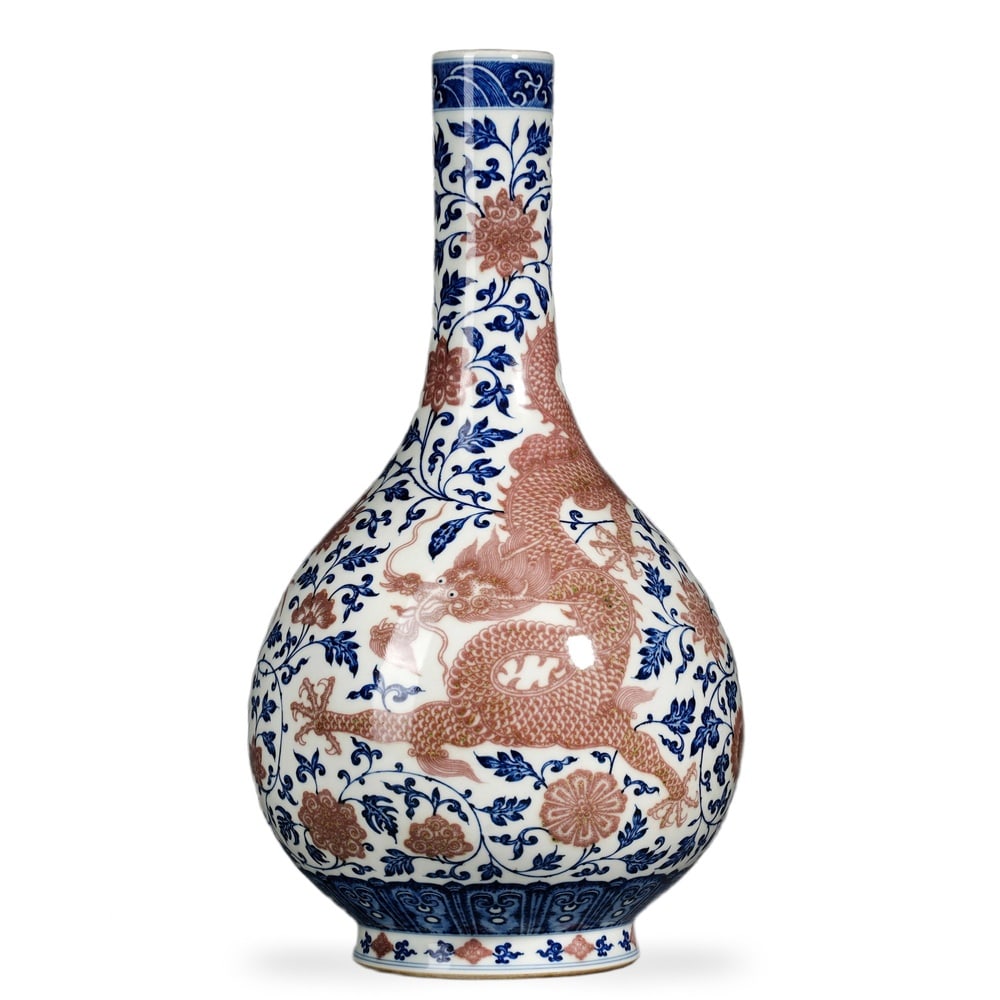 YONGZHENG UNDERGLAZE BLUE AND COPPER-RED 'DRAGON THROUGH LOTUS SCROLLS' GALLBLADDER VASE (1 of 3)
