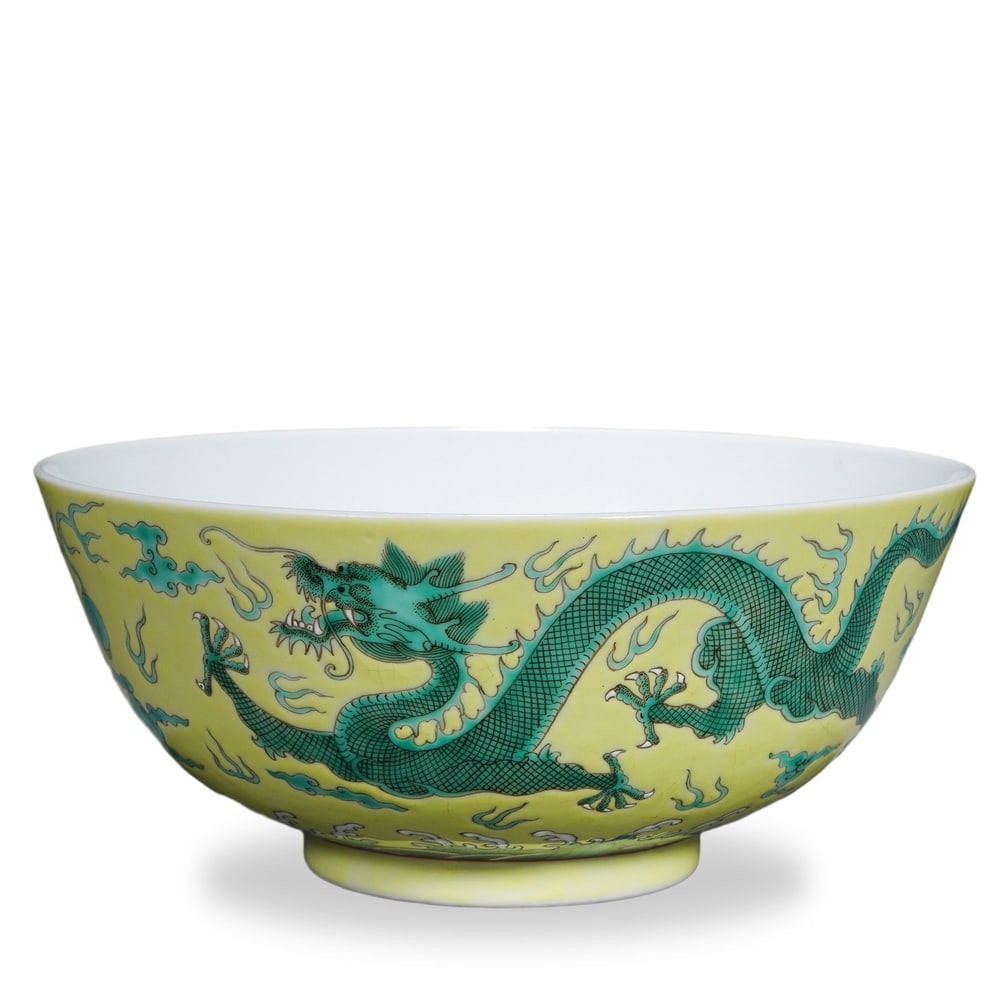 GUANGXU YELLOW-GROUND GREEN-ENAMEL 'DRAGON' BOWL: Guangxu Yellow-Ground Green-Enamel 'Dragon' Bowl Dimensions: H: 3 1/4 in (8.5 cm); D: 7 3/4 in (19.5 cm) This finely potted bowl exemplifies the late-Qing imperial format of yellow-ground green-enamel