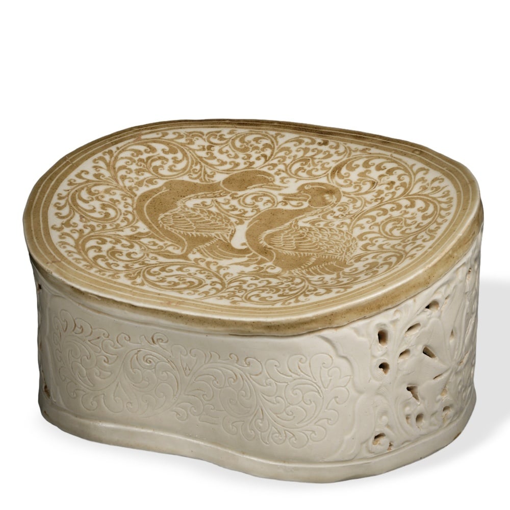 SONG DYNASTY DING WARE IRON-BROWN PAINTED 'MANDARIN DUCKS' RETICULATED PILLOW: Song Dynasty Ding Ware Iron-Brown Painted 'Mandarin Ducks' Reticulated Pillow Dimensions: L: 10 3/4 in (27.5 cm); H: 5 1/2 in (14 cm) This refined ceramic pillow exemplifies one of the most