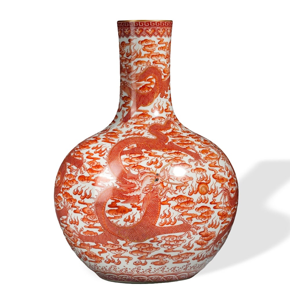 YONGZHENG IRON-RED 'DRAGONS AMONG AUSPICIOUS CLOUDS' CELESTIAL GLOBE VASE (1 of 3)