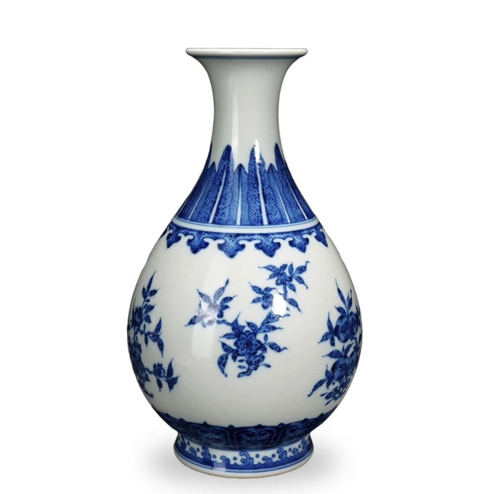 QIANLONG BLUE AND WHITE 'BATS AND PEACHES' YUHUCHUN VASE: Qianlong Blue and White 'Bats and Peaches' Yuhuchun Vase Dimensions: H: 10 1/2 in (26.5 cm); W: 5 1/2 in (14 cm) This elegantly proportioned yuhuchun vase exemplifies one of the most enduring forms of