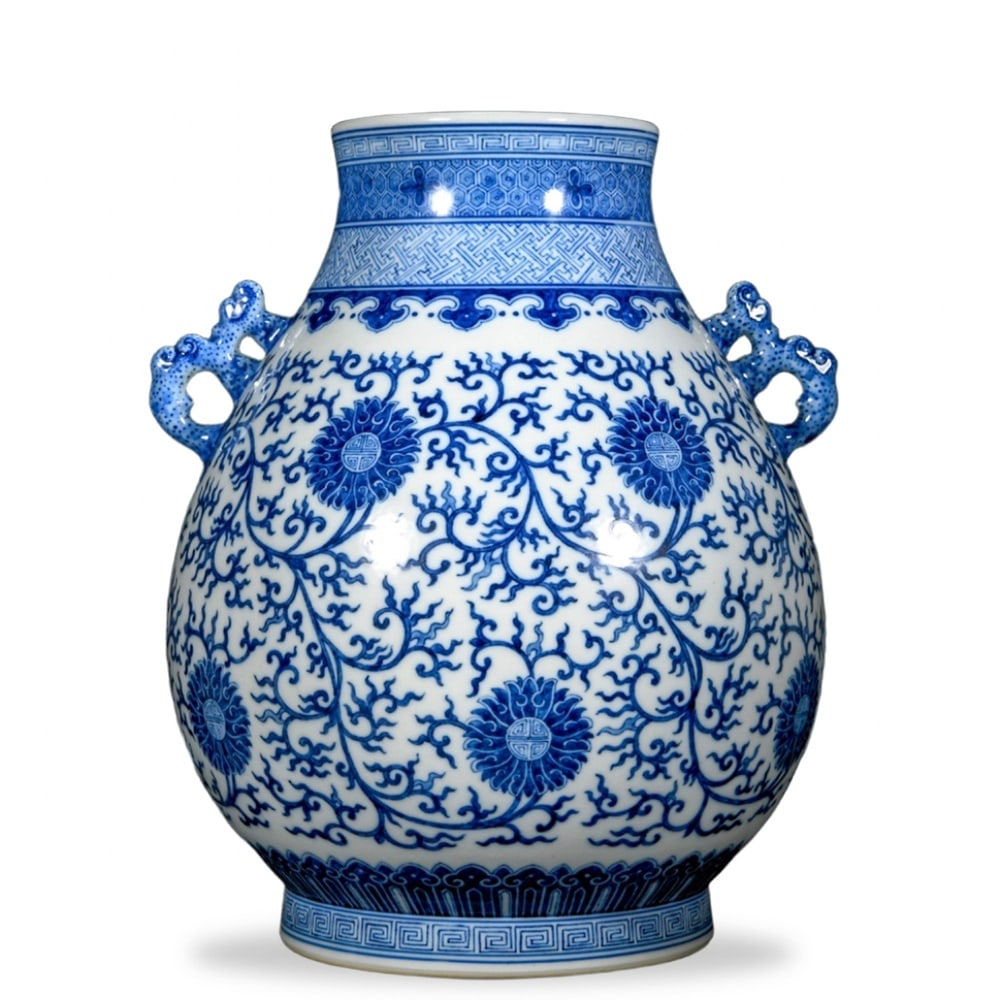 QIANLONG BLUE AND WHITE 'LOTUS SCROLL' ZUN WITH ELEPHANT-HEAD HANDLES (1 of 3)