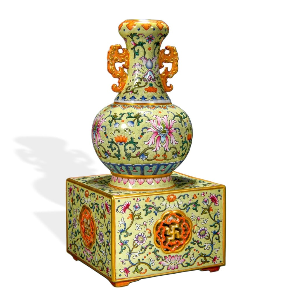 QIANLONG YANGCAI 'FOLIATE SCROLL' DOUBLE-GOURD VASE ON PIERCED SQUARE BASE, CREAM-YELLOW GROUND (1 of 3)