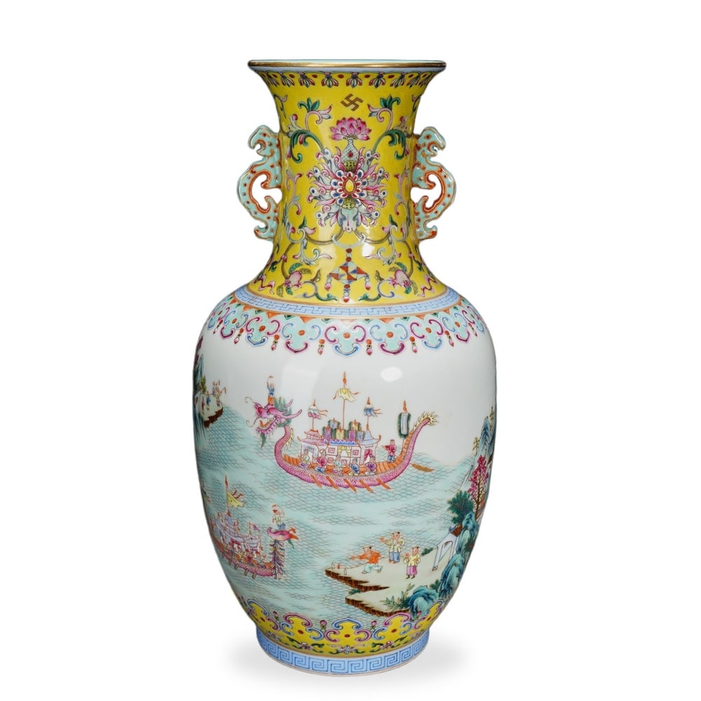 DAOGUANG FAMILLE ROSE 'DRAGON BOAT RACING' VASE ON YELLOW GROUND: Daoguang Famille Rose 'Dragon Boat Racing' Vase on Yellow Ground Dimensions: H: 11 1/2 in (29 cm); W: 6 in (15 cm) This handsome twin-handled vase exemplifies the persistence of high-Qing decorative a