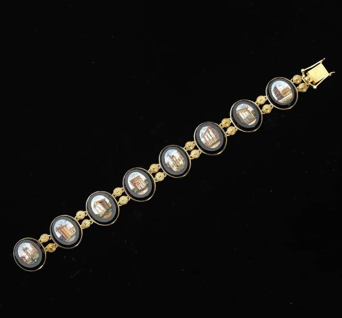 Victorian period (1837-1901) Italian miniature mosaic gold bracelet: Victorian period (1837-1901)Italian miniature mosaic gold braceletMade of 18K gold as a whole, it is inlaid with eight miniature mosaics of ancient Roman ruins, each of which is inlaid with tiny mosai