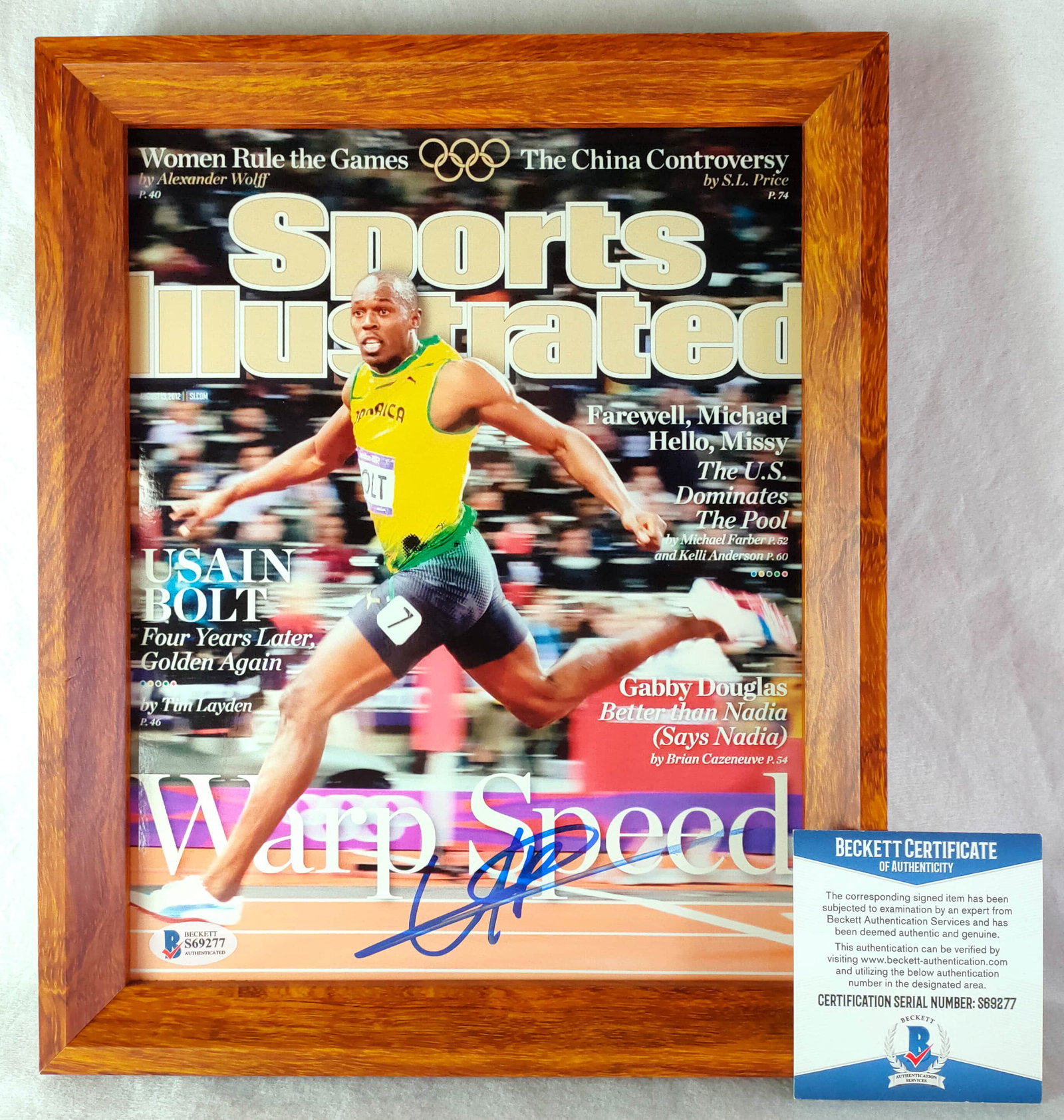 Autograph photo of Bolt, that "flying man" who exceed the speed limit of human beings-identification (1 of 4)